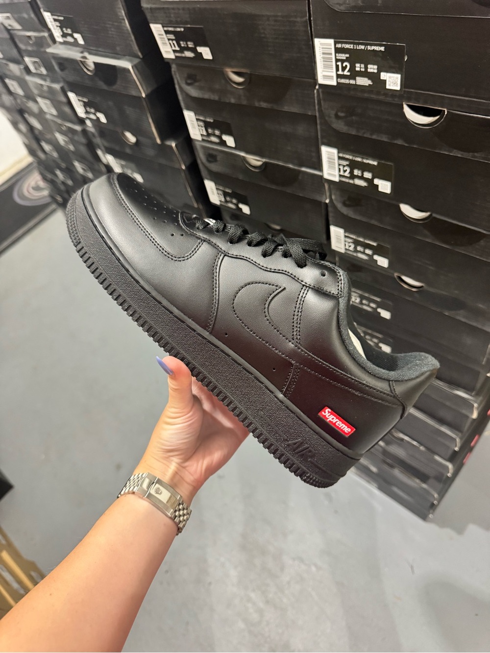 Nike Black Low Top Sneakers with Red Supreme Tab